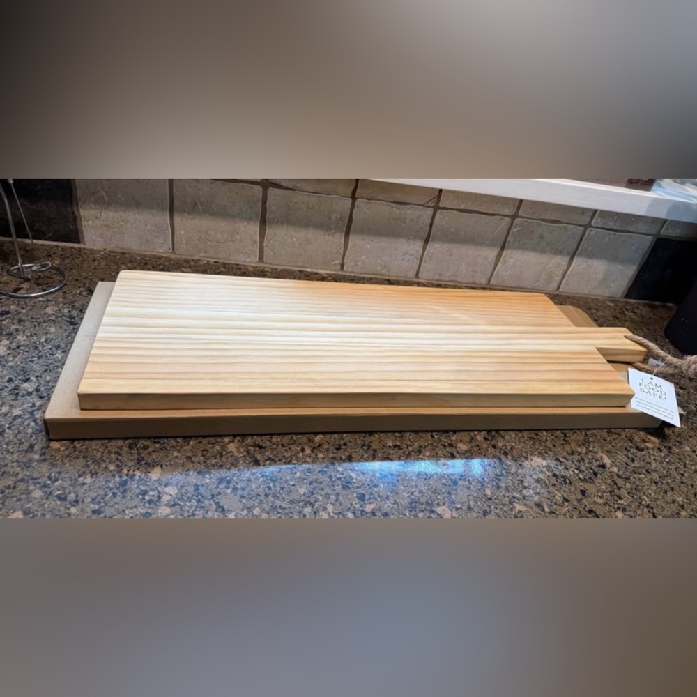 reversible pine wood paddle cutting board. New in box